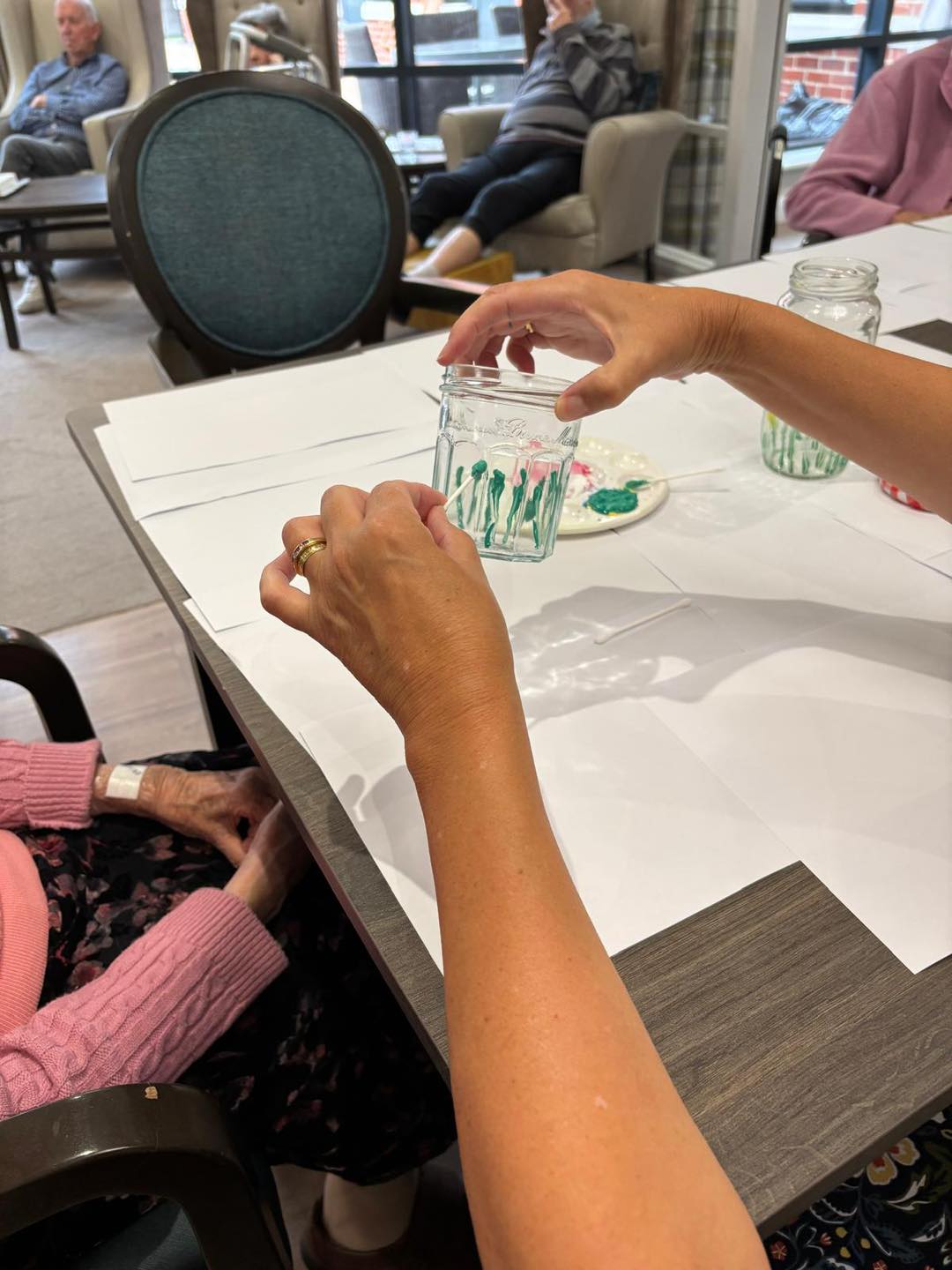 Orchard Manor Residents Shine with Painted Glass Jar Artistry